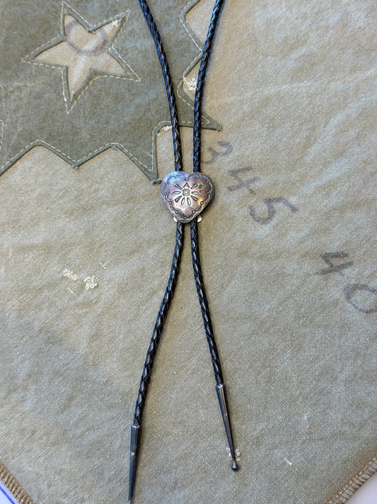 Stamped Silver Heart Bolo Tie — Floral Repoussé, Black Cord